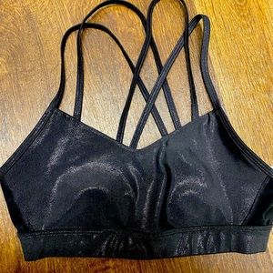 Shiny black strappy sports bra